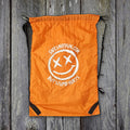 Safe's Not Fun drawstring bag 30x50 with straps on weathered wood